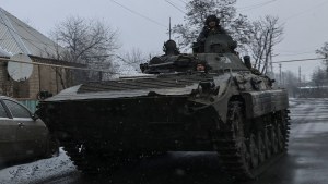 Ukrainian service members ride a BMP-2 infantry fighting vehicle near the frontline town of Bakhmut