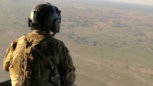 a soldier overlooks Iraq
