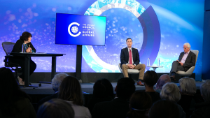 Jessica Tuchman Mathews with Ivo Daalder and George Beebe in chairs on the Council stage with a blue background.