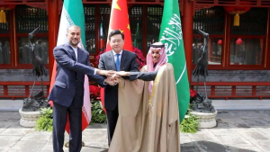 Iranian Foreign Minister Hossein Amir-Abdollahian and Saudi Arabia's Foreign Minister Prince Faisal bin Farhan Al Saud and Chinese Foreign Minister Qin Gang shake hands during a meeting in Beijing, China
