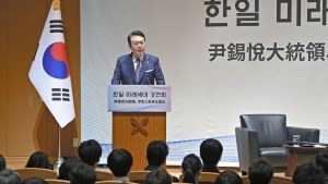 Yoon delivers a speech to students at Keio University in Tokyo