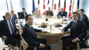World leaders gather around a table at the G-7 summit
