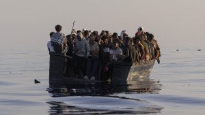 Migrants with life jackets provided by volunteers of the Ocean Viking, a migrant search and rescue ship run by NGOs SOS Mediterranee and the International Federation of Red Cross.