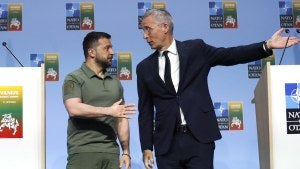 NATO Secretary General Jens Stoltenberg, right, and Ukraine's President Volodymyr Zelenskyy prepare to leave the podium