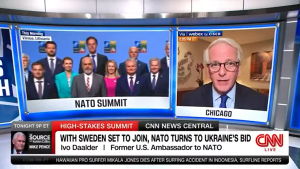 Screenshot of NATO wraparound screens on CNN studio set - NATO leaders on screen at left and Ivo Daalder on screen at right.
