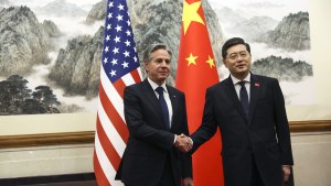 US Secretary of State Antony Blinken, left, shakes hands with Chinese Foreign Minister Qin Gang