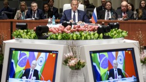 South Africa BRICS Summit with screens in foreground showing Putin