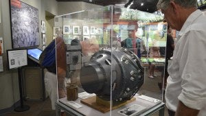  a visitor to the Bradbury Science Museum in Los Alamos, N.M. examines a replica of the gadget