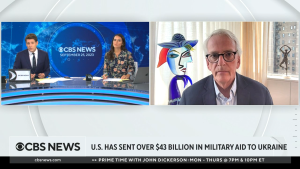 Ivo Daalder on CBS News at right, anchors at left in front of a blue background.