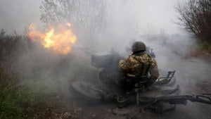 Ukrainian National guard soldiers fire at Russian positions from an anti-aircraft gun 