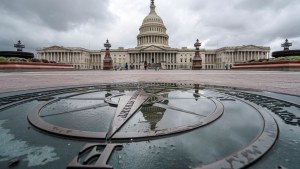 The U.S. Capitol Dome is reflected in a rain puddle on the compass star on the east side of the building, Sunday, Sept. 24, 2023.