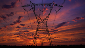 The sun rises near power lines in Monee, IL.