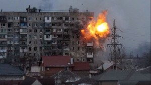 n explosion erupts from an apartment building after a Russian army tank fired on it in Mariupol, Ukraine