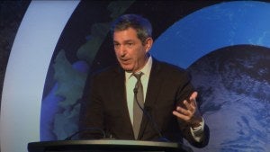 Stavros Lambrinidis speaks at a podium with a microphone