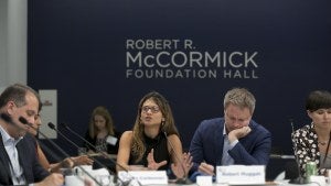 A group of people attending a workshop at the Robert R. McCormick Foundation Hall.