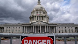 a danger sign in front of the US Capitol