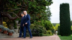 President Joe Biden and China's President President Xi Jinping walk in the gardens 