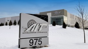 Exterior image of the AIT building with its sign in the foreground