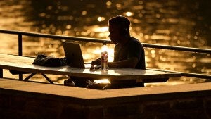 A remote worker at Lake Roland in Maryland. 