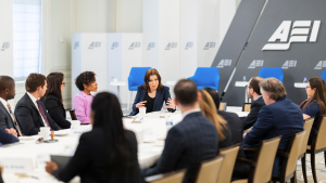 A group of Emerging Leaders sit around a table.