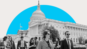 Black and white photo of people walking in front of the US Capitol