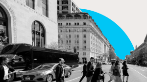 Black and white photo of people crossing a street