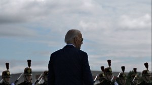 President Joe Biden watches Republican Guards as he arrives in France