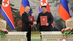 North Korean leader Kim Jong Un and Russia's President Vladimir Putin shake hands after signing a comprehensive strategic partnership