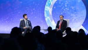 Congressman Raja Krishnamoorthi and Craig Kafura, Director of Public Opinion and Foreign Policy at the Chicago Council on Global Affairs on stage at the Chicago Council on Global Affairs.