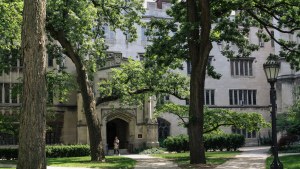 Exterior of a building on the University of Chicago campus amongst trees
