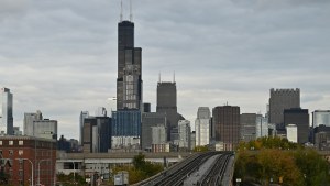 The Chicago skyline behind train tracks