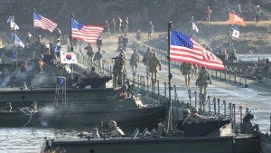 Flags of South Korea and the United States flutter before a joint river-crossing drill between South Korea and the United States