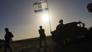 Israeli soldiers are seen near the Gaza Strip border