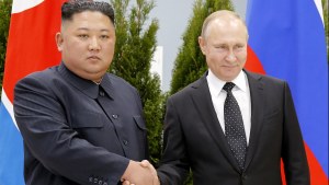 Russian President Vladimir Putin, right, and North Korea's leader Kim Jong Un shake hands