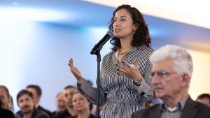 Event attendee speaking into the Q&A mic at a Council event