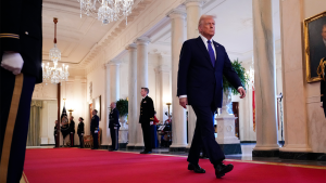 President Trump walking through the White House