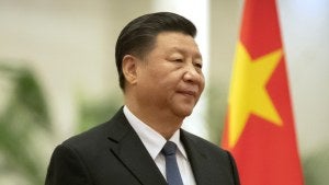 Chinese President Xi Jinping stands during a welcome ceremony in Beijing