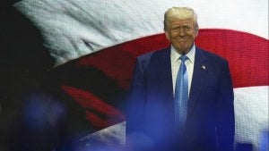 President Donald Trump in front of an American flag