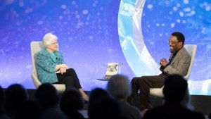 Fay Hartog-Levin and Judge Chile Eboe-Osuji on stage.