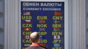 A man stands at a currency exchange office in St. Petersburg, Russia