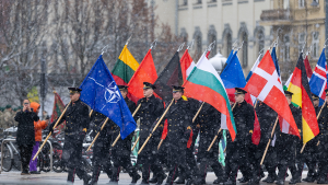 Lithuania's military officers march with flags of NATO's nations during a military parade ceremony in Vilnius, Lithuania on Armed Forces Day, November 23, 2024.