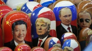 Traditional Russian wooden dolls depicting China's President Xi Jinping, US President-Donald Trump and Russian President Vladimir Putin