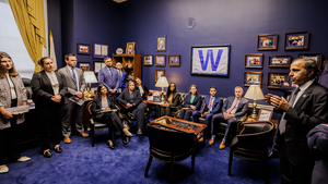 A group of Emerging Leaders sits inside Congressman Raja Krishnamoorthi's office.