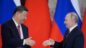 Chinese President Xi Jinping shakes hands with Russian President Vladimir Putin on May 8, 2025.