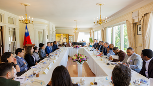 Members of the Emerging Leaders Program sit around a roundtable at Twin Oaks in Washington DC.