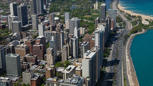 An aerial view of Lake Shore Drive and Chicago's skyline heading north towards Lincoln Park.