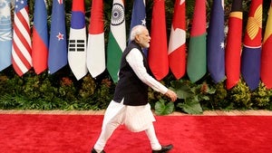India's Prime Minister Narendra Modi walks past the flags of participating countries at the Association of Southeast Asian Nations (ASEAN) Summit, in Jakarta, Indonesia on September 7, 2023.