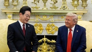 US President Donald Trump and South Korean President Lee Jae Myung sitting in a meeting.