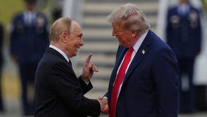 President Donald Trump greets Russia's President Vladimir Putin