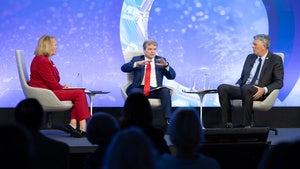 Mary Ann Ahern with Congressmen LaHood and Quigley on the Council's stage.